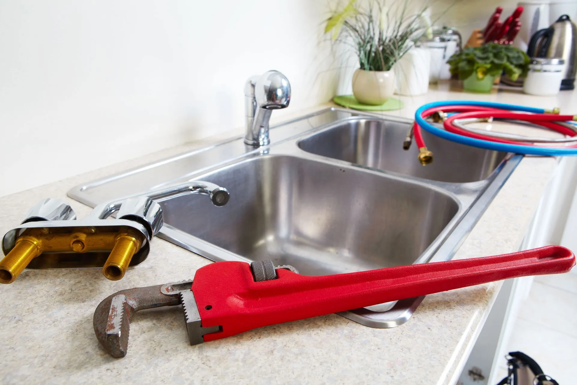 Plumbing tools near kitchen sink